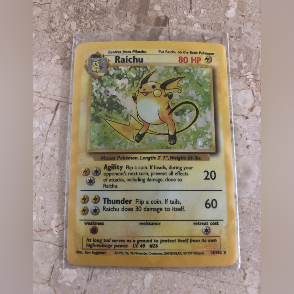 1990’s vintage holo Raichu Pokémon card 14/102
